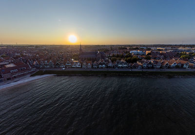 Volendam haven high angle view of townscape against sky during sunset