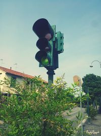 Low angle view of street light against sky