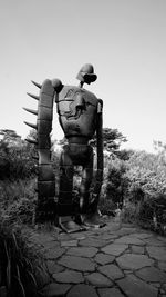 Rear view of man standing against clear sky