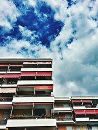 Low angle view of building against cloudy sky