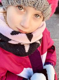 Close-up portrait of girl wearing warm clothing