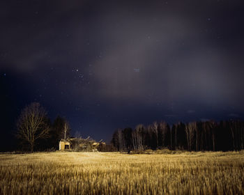 Scenic view of field against sky at night