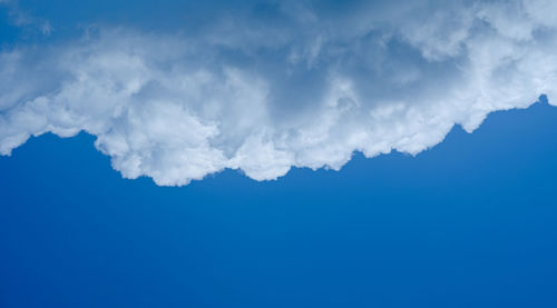 Low angle view of cloudscape against blue sky