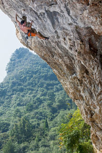 Man climbing at odin's den in yangshuo, a climbing mekka in china