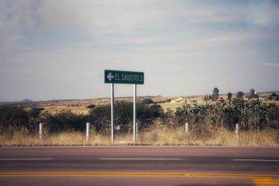 Road signs against sky