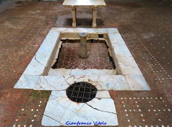 High angle view of manhole on footpath