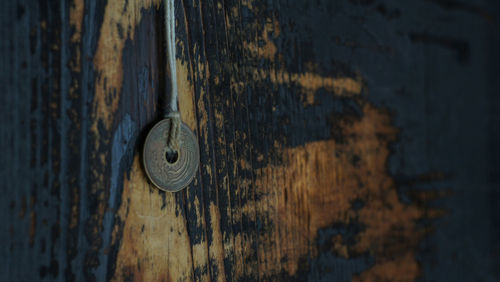 Close-up of padlock hanging on door