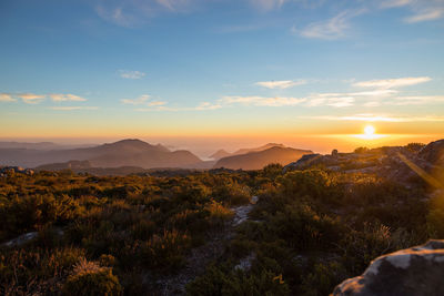 Scenic view of mountains against sky during sunset