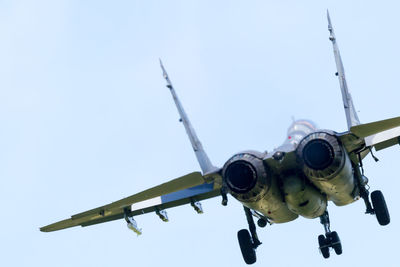 Low angle view of airplane against clear sky