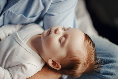 Cute baby sleeping on bed