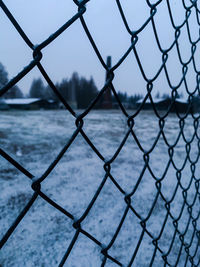 Full frame shot of chainlink fence against sea