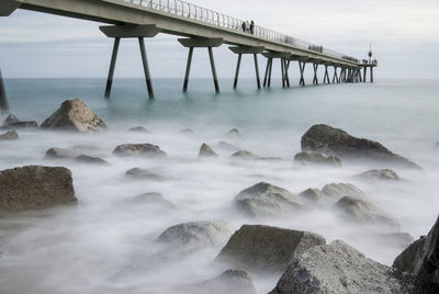 Scenic view of pier over sea against sky