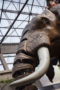 Statue on hand against the sky