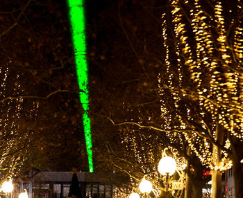 Low angle view of illuminated street light at night