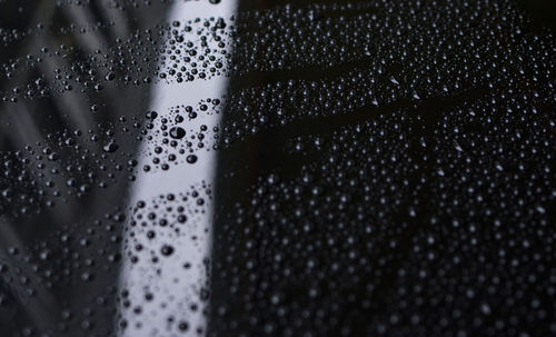 Close-up of water drops on table