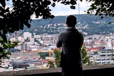 Rear view of a man standing in city