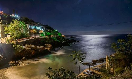 Scenic view of sea against sky at night