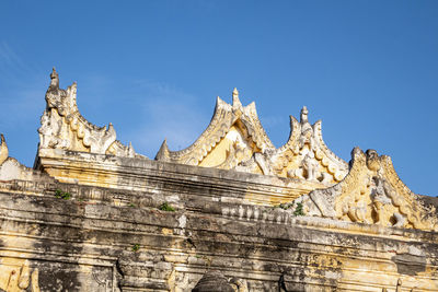 Low angle view of temple against blue sky