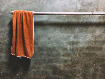 Close-up of clothes hanging on wall