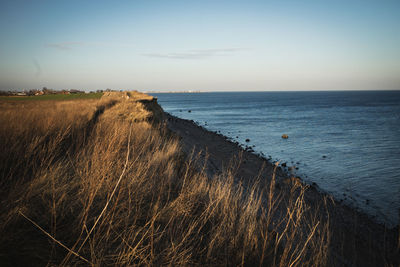 Scenic view of sea against clear sky during sunset