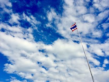 Low angle view of flag against sky