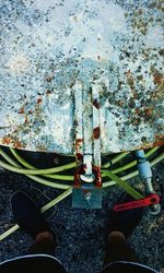 Low section of person standing on tiled floor