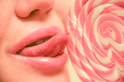 Close up of woman licking lolipop