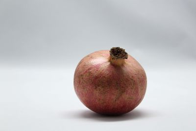 Close-up of apple against white background