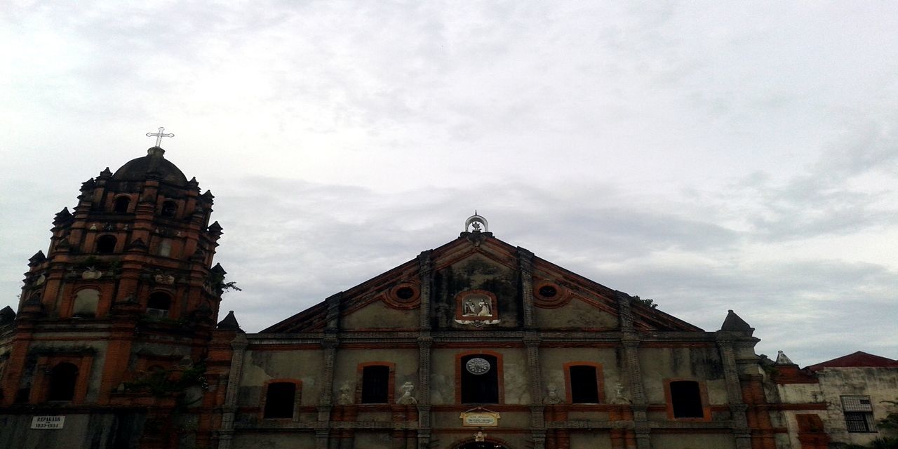 architecture, building exterior, built structure, low angle view, sky, church, religion, place of worship, spirituality, cloud - sky, history, cloudy, window, high section, cathedral, cloud, outdoors, day