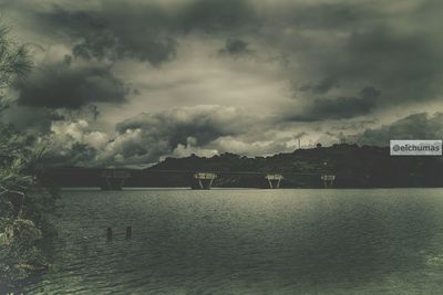 Scenic view of sea against cloudy sky