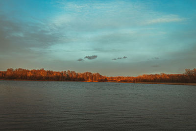 Scenic view of lake against sky during sunset