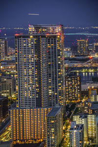 Illuminated buildings in city at night