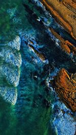 High angle view of rocks in sea