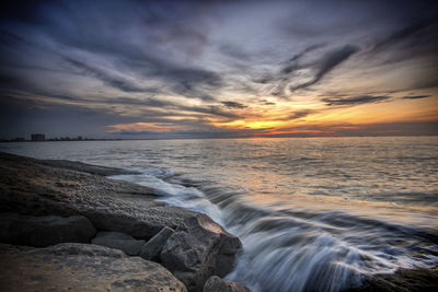 Scenic view of sea against sky during sunset