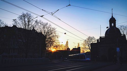 Silhouette of built structures at sunset