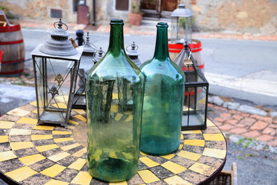 Close-up of wine bottles on table