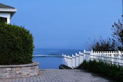 Scenic view of sea against clear blue sky