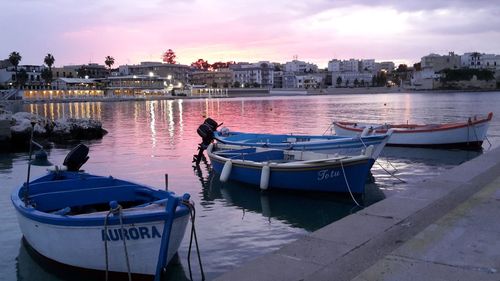 Boats moored at harbor