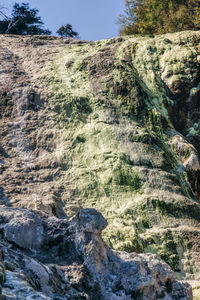 View of rock formation on land against sky