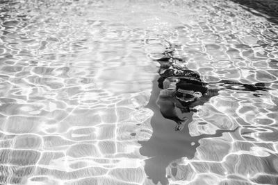 Man swimming in pool