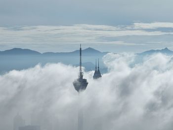 Kl tower and klcc covered by low cloud, view from high angle