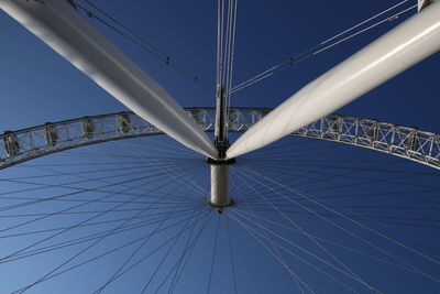 Low angle view of bridge against clear blue sky