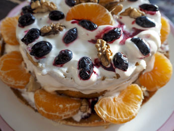 Homemade cake decorated with fruits and berries