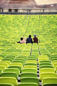 Rear view of people sitting on chair