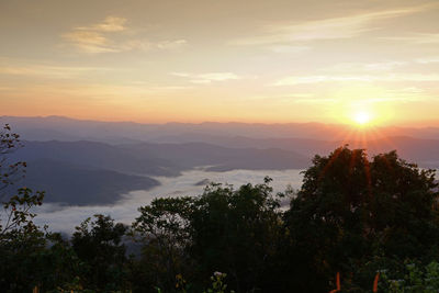 Scenic view of mountains against sky during sunset