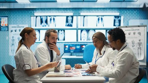 Female doctor examining patient in laboratory