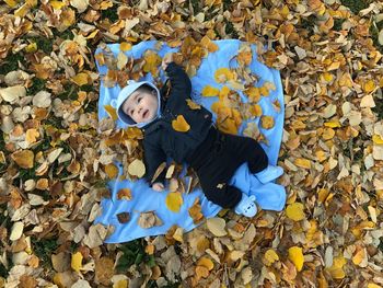 High angle view portrait of child during autumn