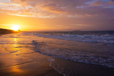 Scenic view of sea against sky during sunset