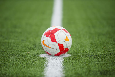 Close-up of soccer ball on field