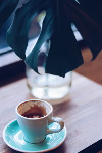 Close-up of coffee cup on table